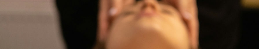 a woman getting a facial massage at a sp