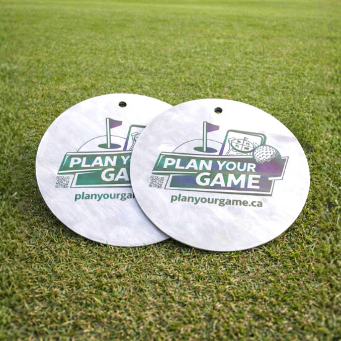 Stainless steel practice putting discs, 'PLAN YOUR GAME'.