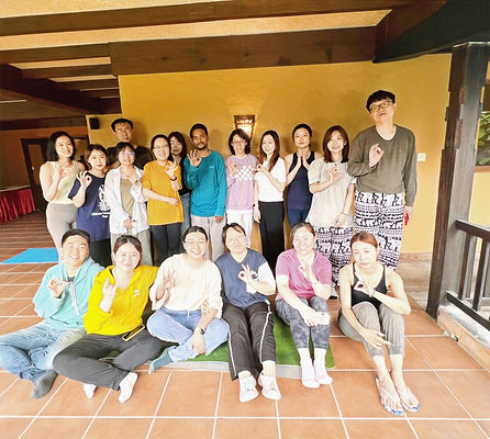 Kaushal Kunwor Mokshya Yoga Retreat leader posing with group of East Asian guests picture from Mokshya Yoga Retreat | Nagarkot | near Kathmandu | Nepal