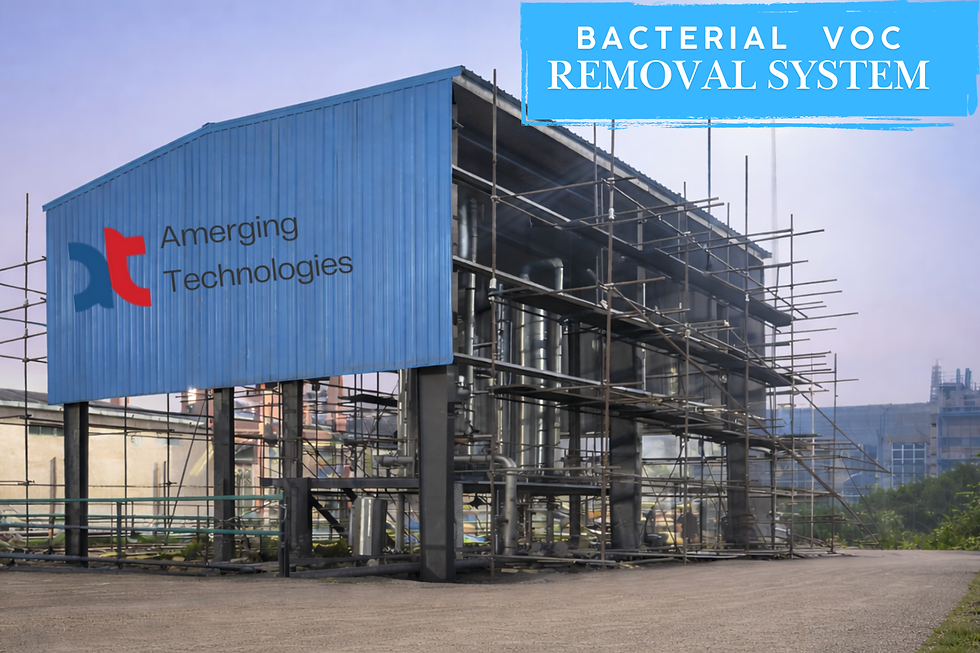 Blue industrial building with scaffolding; "Amerging Technologies" logo visible. Text reads "Bacterial VOC Removal System." Overcast sky.