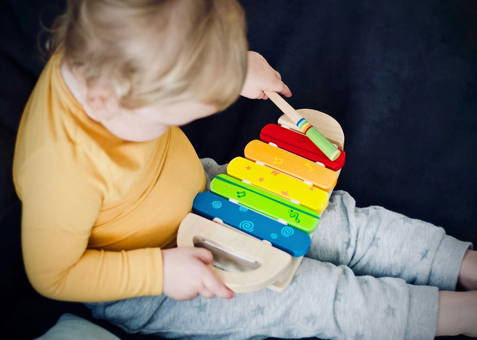 child playing xylophone
