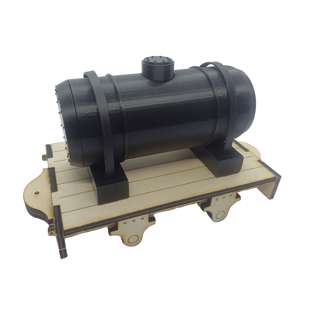 An oil tank, complete with pla straps on top of an unpainted 16mm scale flat wagon