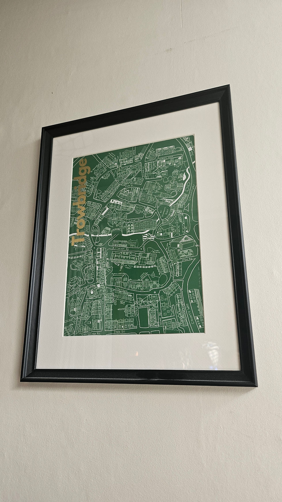 Thumbnail: Framed art print of the coloured illustrated Trowbrige town map in an example black frame