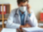 A doctor deep in thought embodies the balance between patient care and administrative responsibilities.