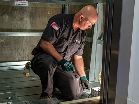 Elevator technician performing preventive maintenance to reduce downtime