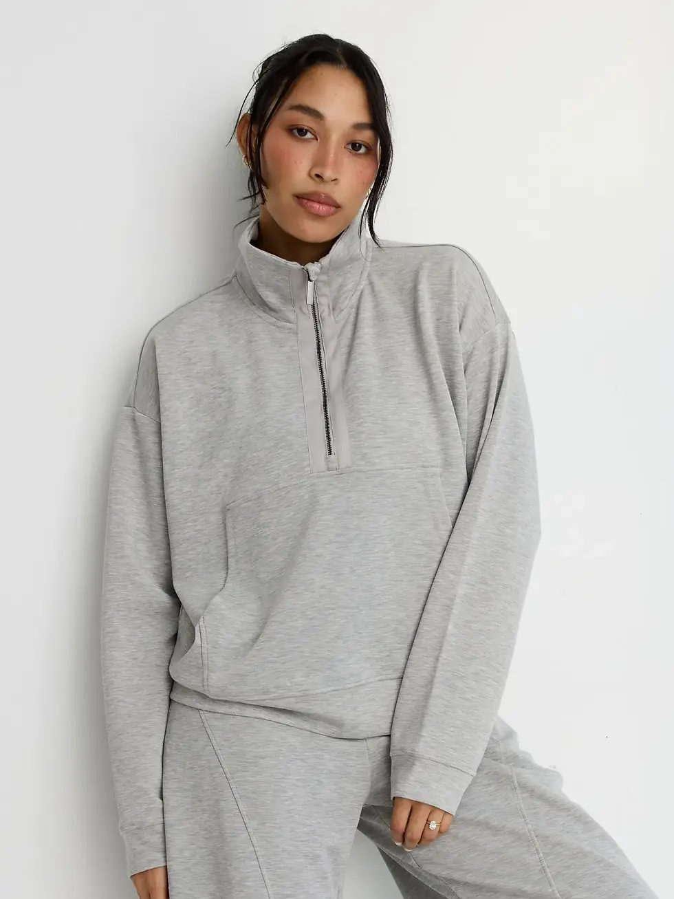 women wearing grey jumper front view