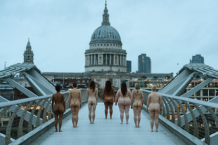 Group of women walking naked across the Millennium Bridge for International Women's Day, a body autonomy photography project