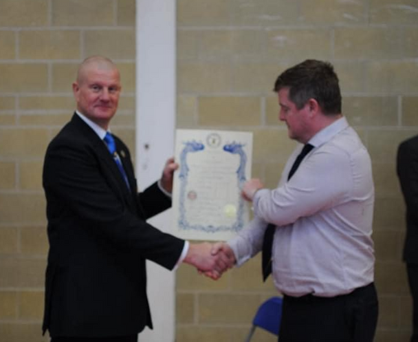 Mr Paul Lolley receiving his 6th Degree Taekwondo promotion from the International Taekwondo Council in 2022.
