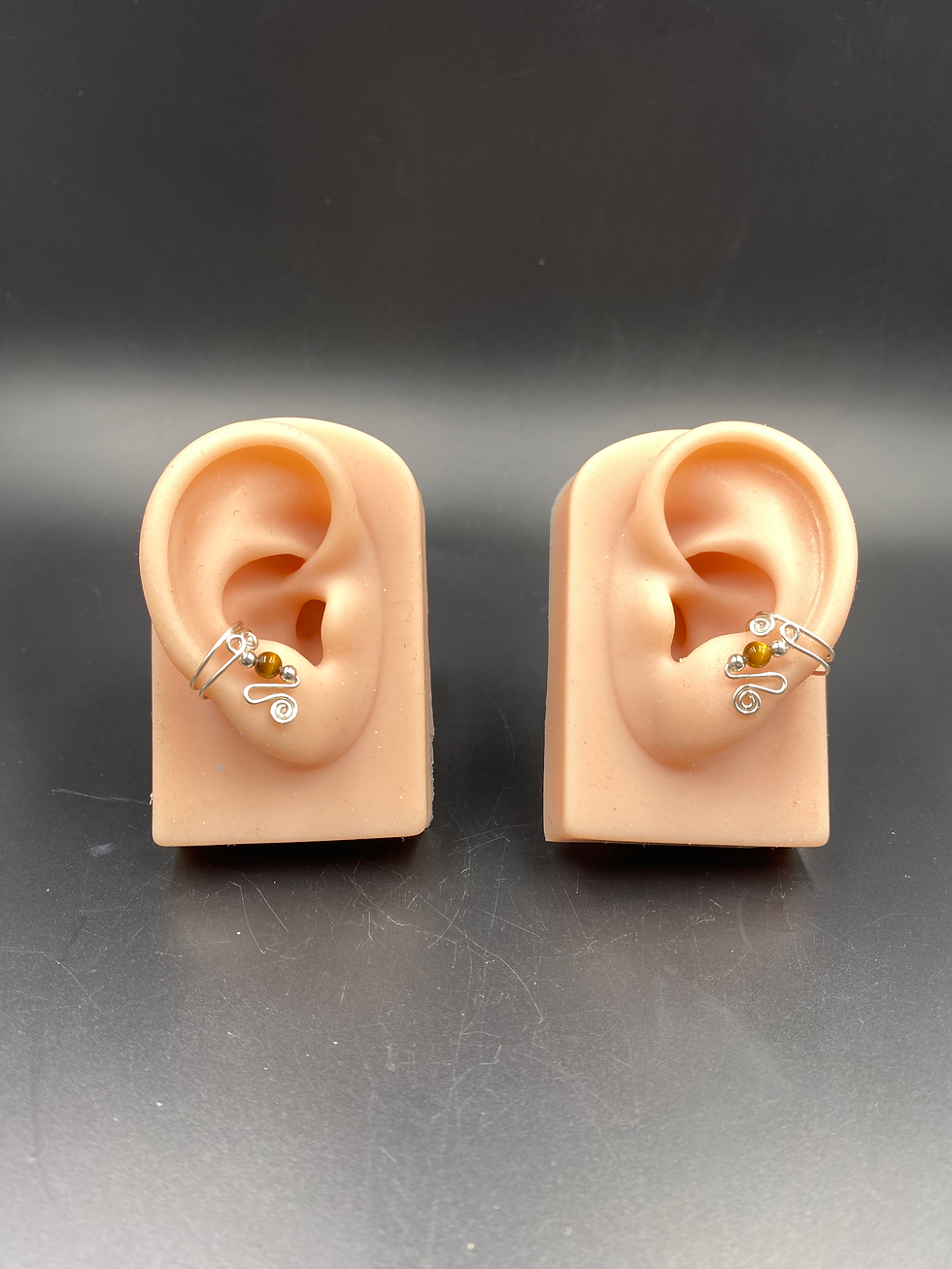 Sterling silver ear cuffs with Tiger's Eye stones. Small and adjustable.