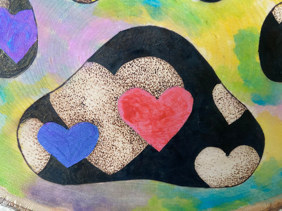 Thumbnail: Colorful hearts painted on wood slice