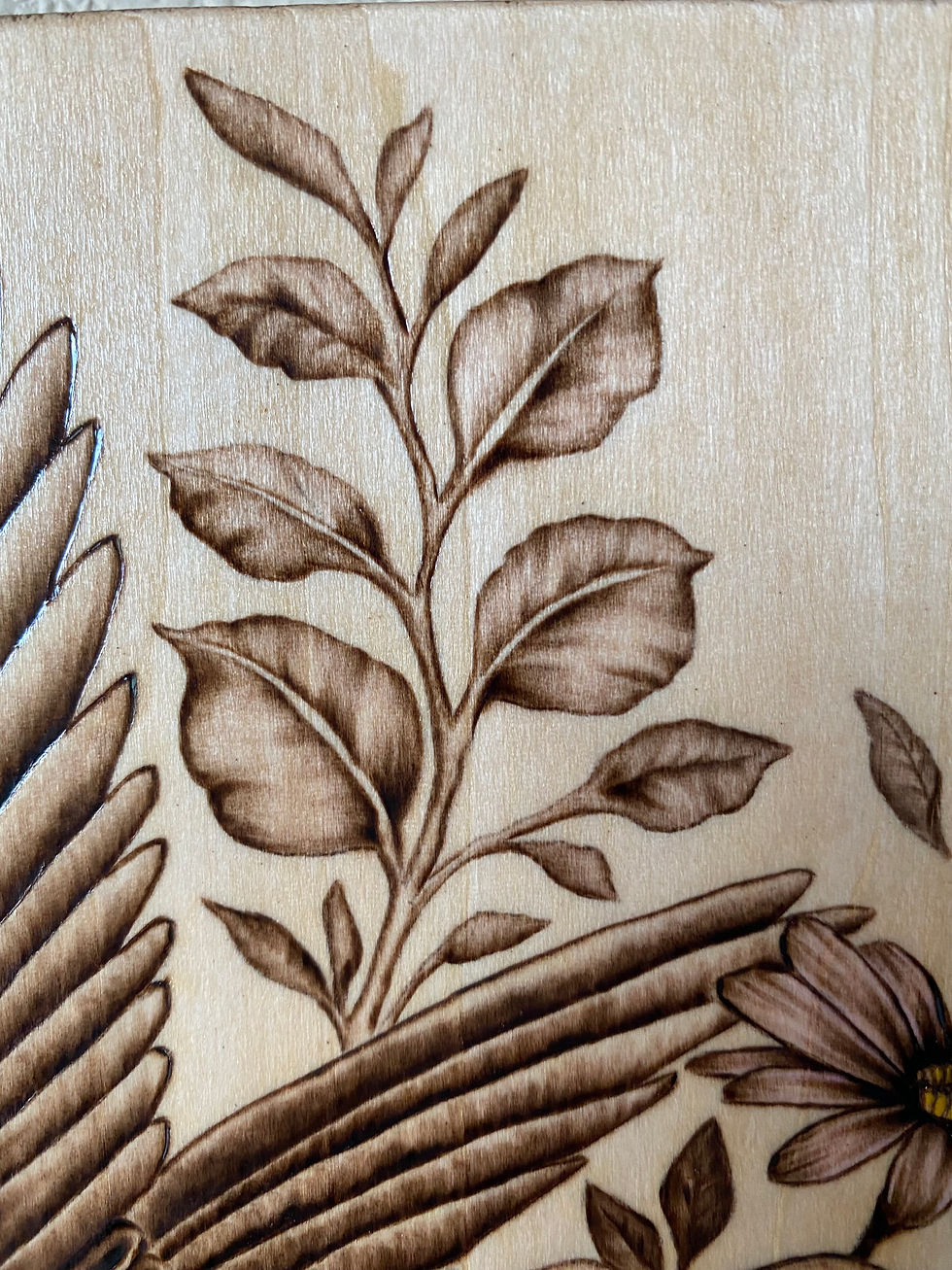 Thumbnail: close up view of Wood-burned floral design: leaves and flowers