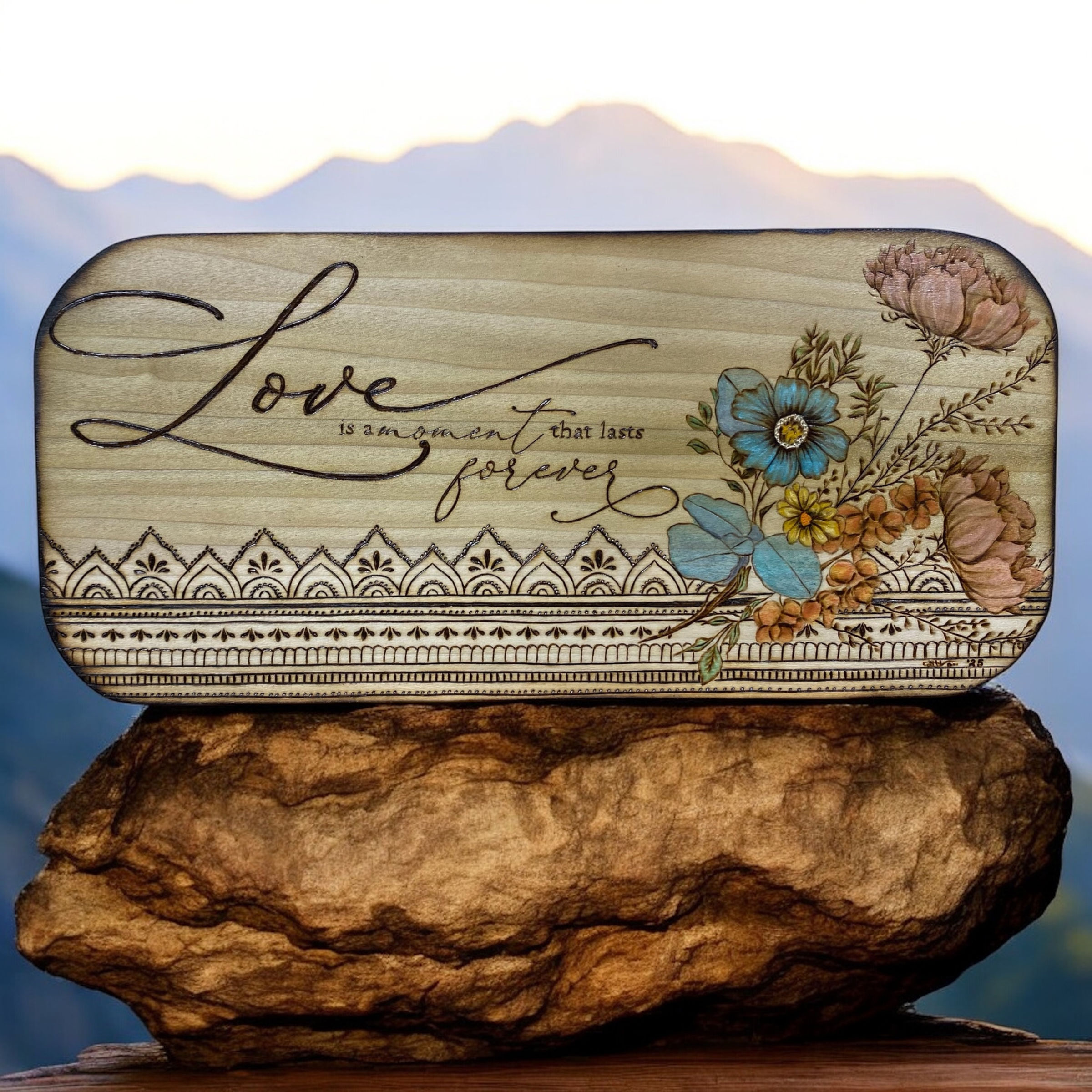 Staged product on a rock with mountain background