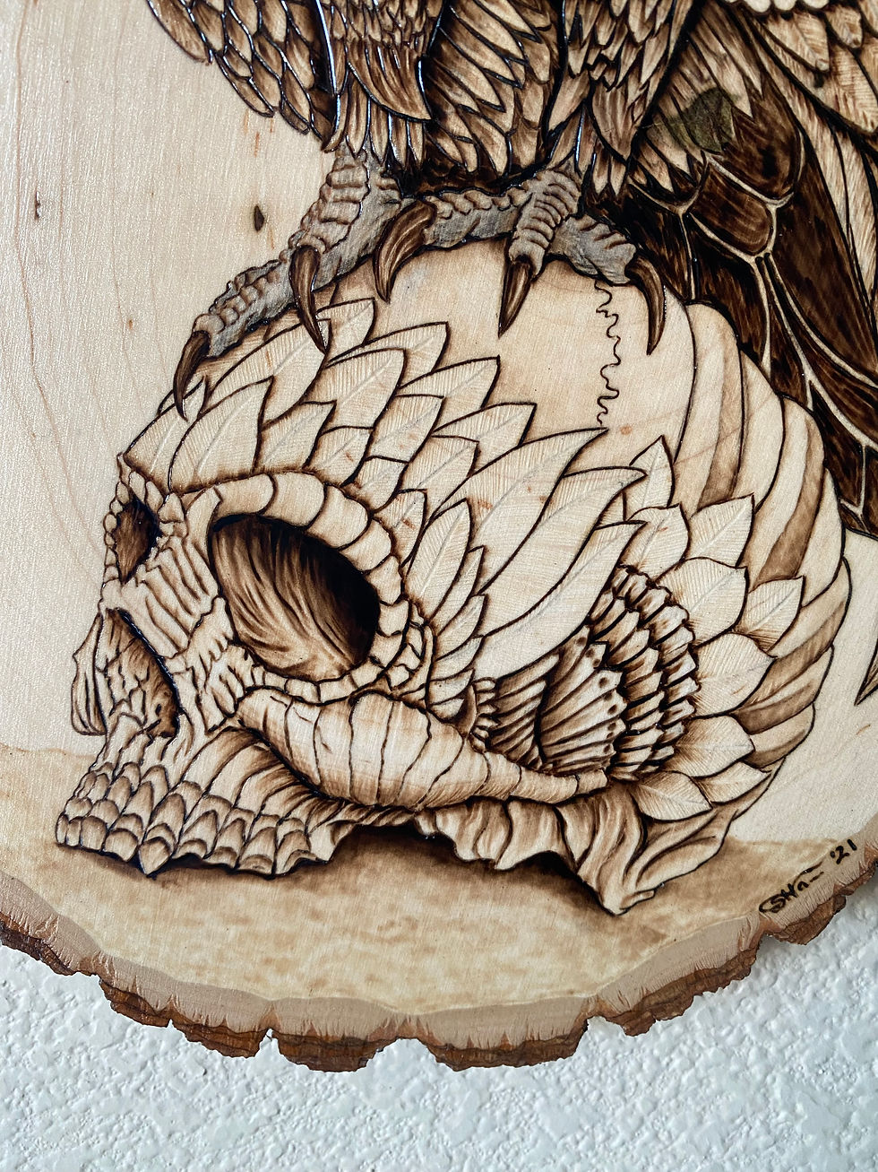 Thumbnail: Wood-burned bird perched on skull