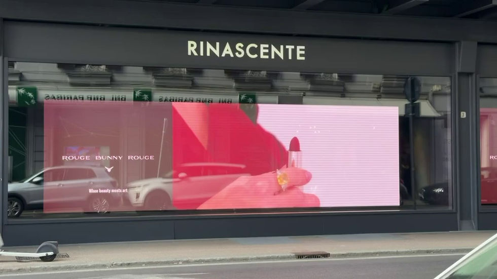 Rinascente store front in Rome with the Rouge Bunny Rouge campaign on its window screens