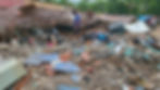 An earthquake survivor inspects the rubble of a collapsed home in Bogo City. Photo courtesy of CDN
