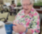 Elaine with her Detroit Lions coffee mug and Detroit Lions bracelet. Photo by Theodore Lewis
