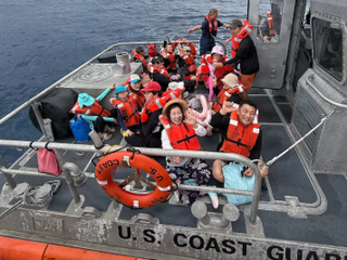 US Coast Guard, Guam Fire Department rescue 45 people from boat off Agat