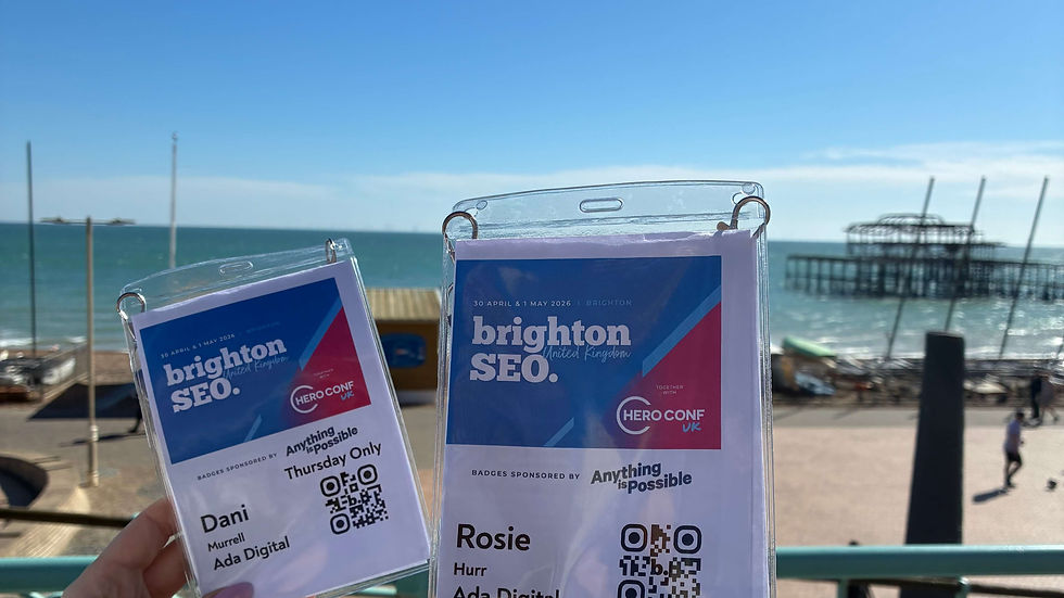 Dani and Rosie's brightonSEO passes held next to Brighton's old pier