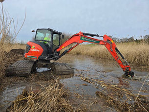 Digger dredging a river