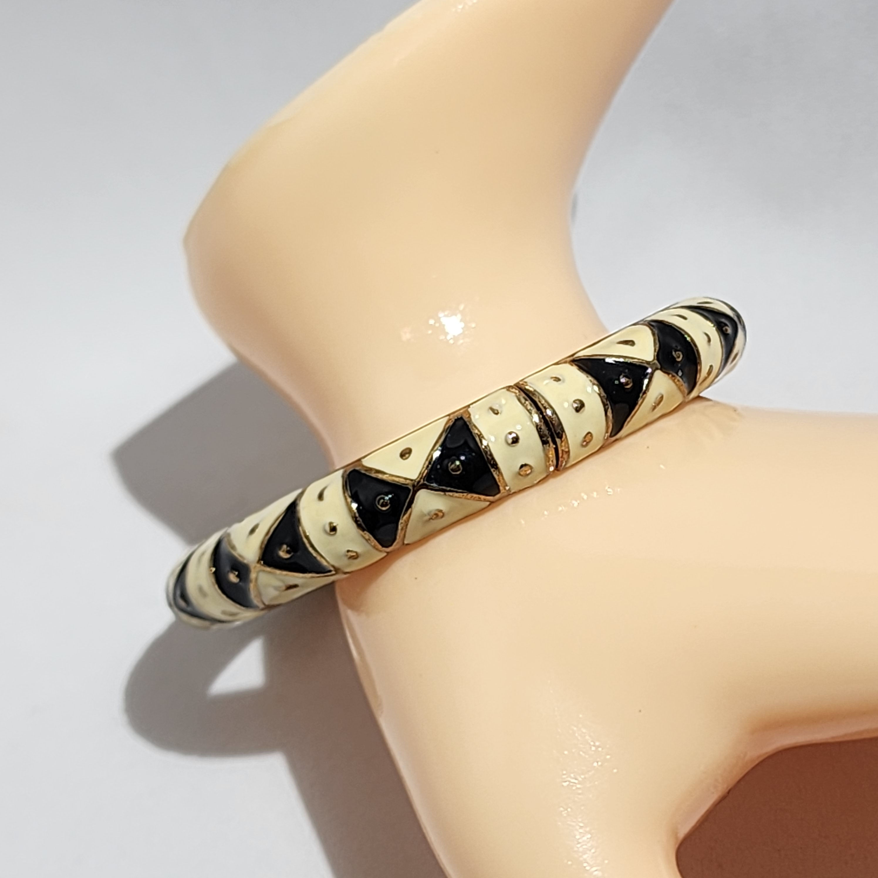 Joan Rivers black and vanilla cream enameled hinged  clapper cuff