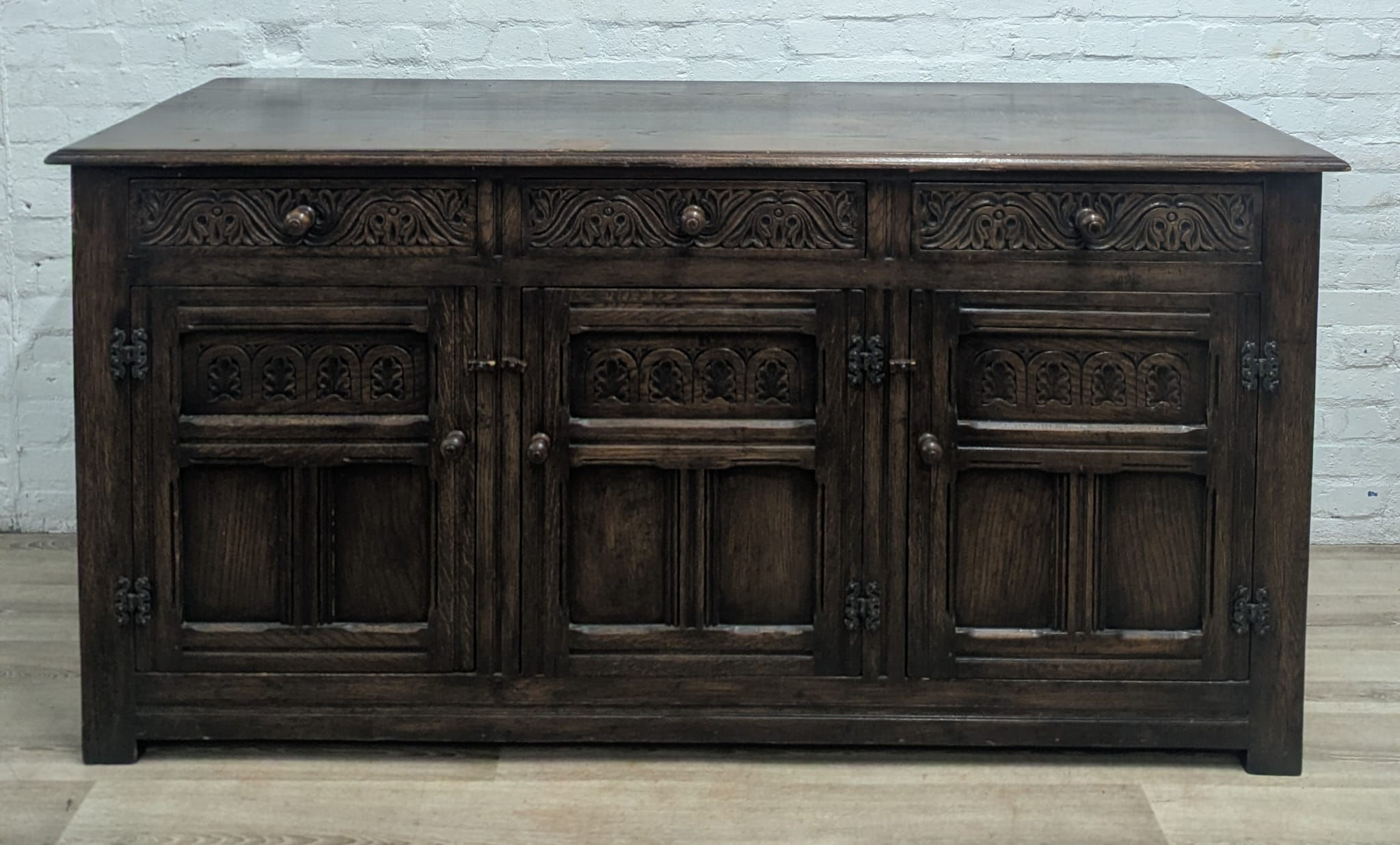 Early 20th century oak baronial style sideboard 