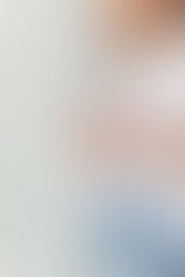A woman holds a wine glass while looking out the window - Light and Bright Personal Branding Photos NOVA