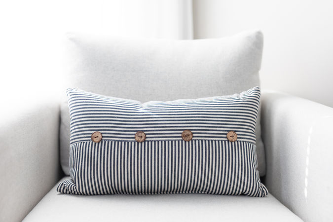accent chair with decorative pillow