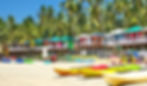 A beach with shacks.
