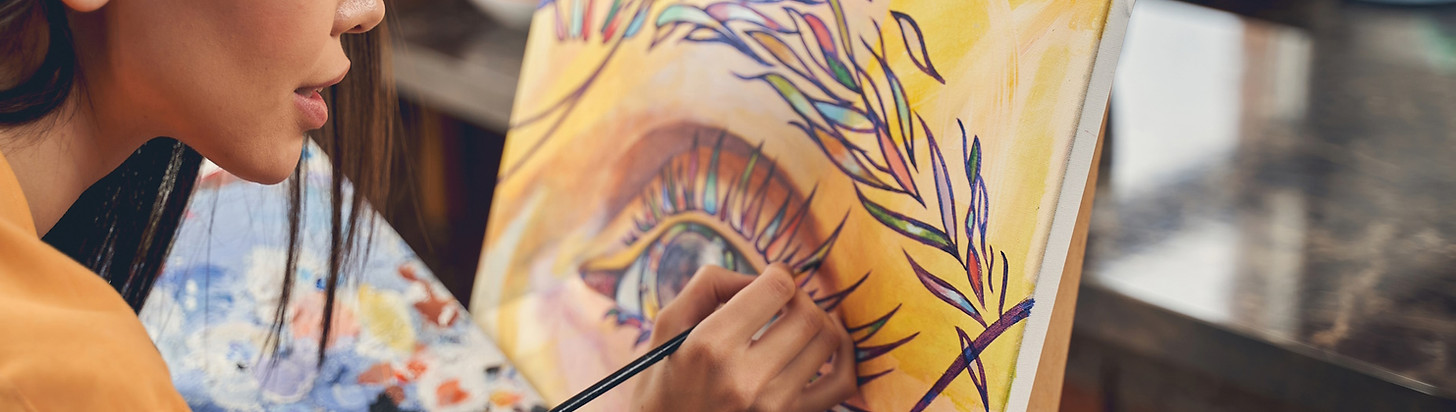 A woman painting a colorful eye on a canvas; text for "Job Switch & Career Change Coaching" for everyone who wants to redefine their career path and start anew.