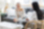 Two women engaged in a coaching session with Career Momentum, working on career development strategies.