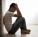 XS man-leaning-against-wall-mental-health.jpg