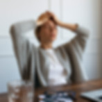medium-shot-blurry-woman-sitting-chair.jpg