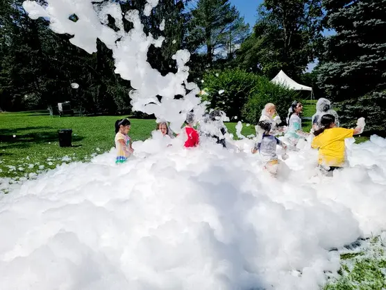 Foam DJ parties for families are an absolute blast! With pulsating beats and foam cannons filling the air, everyone dances and frolics in the sea of bubbles. It's a sensory extravaganza that delights kids and adults alike, creating unforgettable memories of laughter and fun for the whole family.