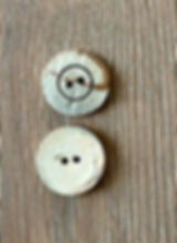 light coconut buttons, one from the front and one from the back