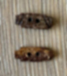 rectangular buttons, one from the front and one from the back