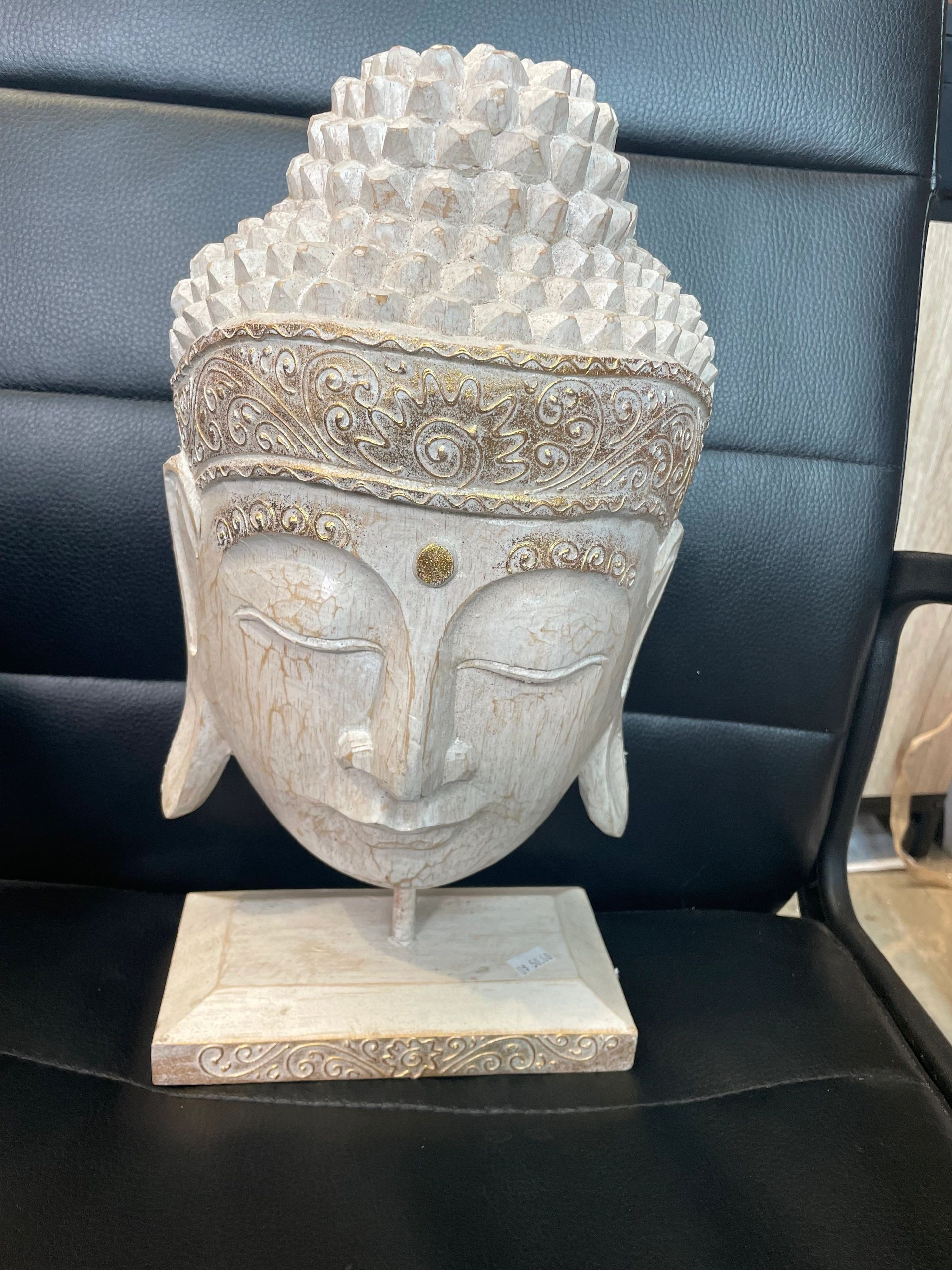 Hand carved wooden Buddha head