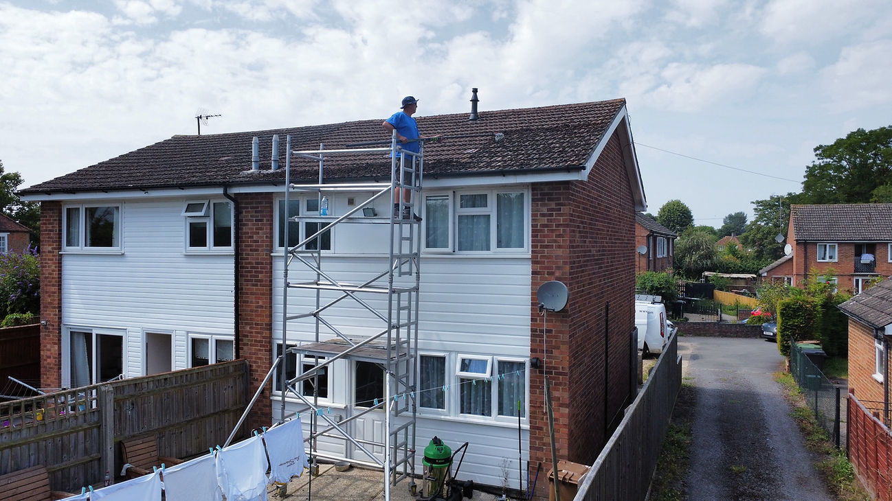 Cleaning a property using scaffolding