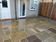 Patio with different coloured slabs