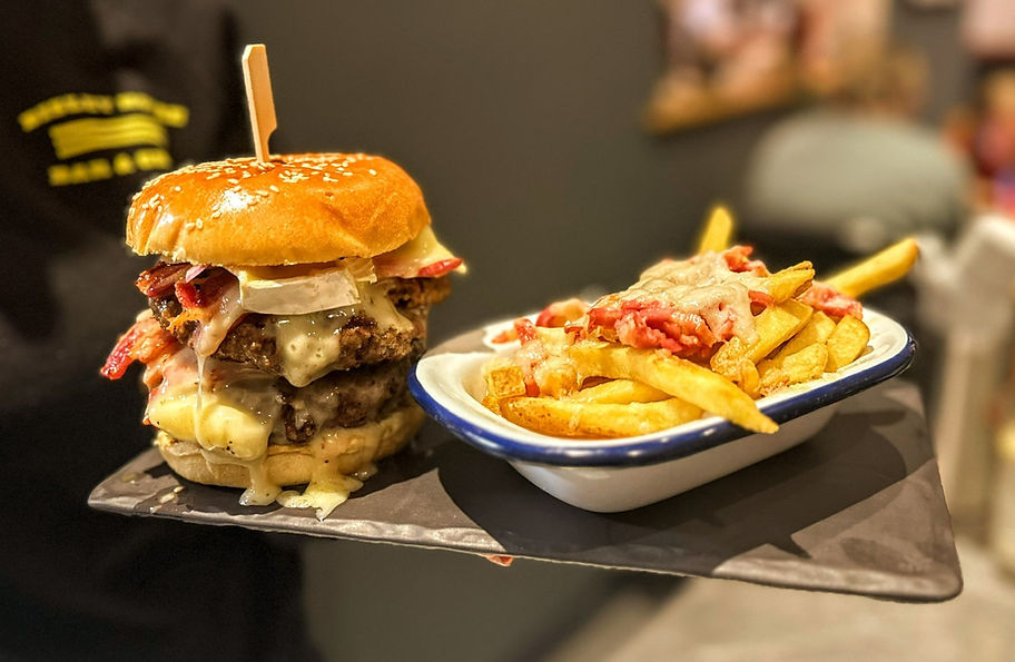 A burger with a side of dirty fries