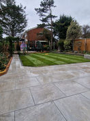 New turf with a bordering paved path