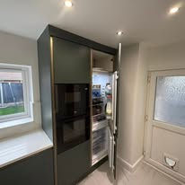 Newly installed kitchen with integrated fridge freezer
