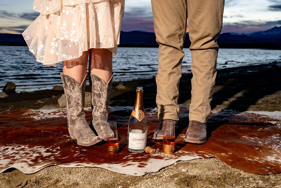 Couple poses during Engagement Session at McIntosh Lake in Longmont, Colorado.