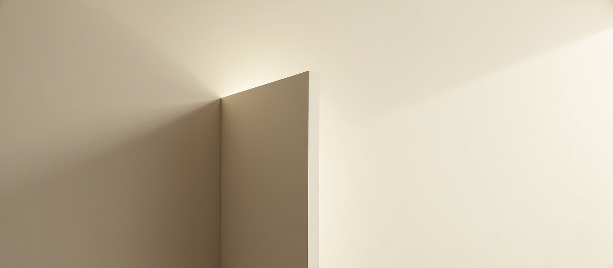 Beige wall with soft ambient lighting highlighting the smooth finish