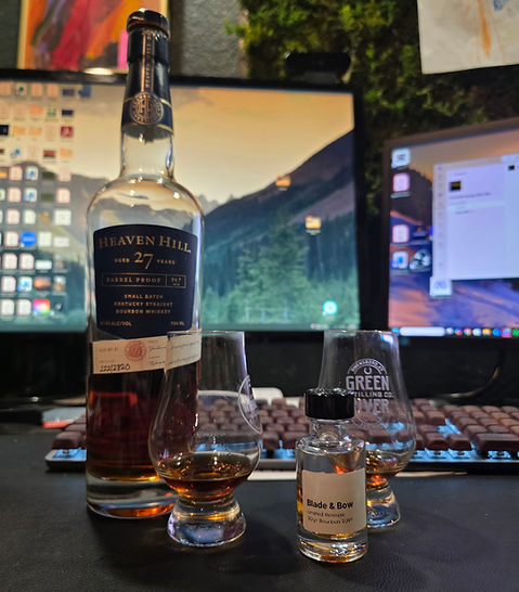 A bottle of Heaven Hill 27yr side by side with a sample of the Blade & Bow 30yr. Two ultra aged super premium pours.