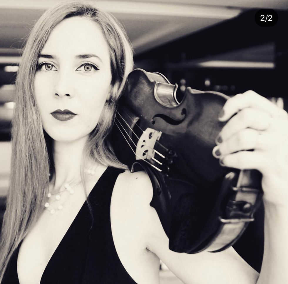 Elegant violinist performing at luxury destination wedding in Mexico