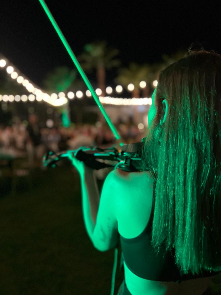 Elegant violinist performing at luxury destination wedding in Mexico