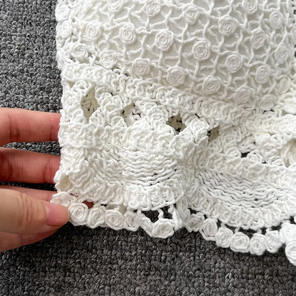 Thumbnail: zoom in of embroider detailing on two-piece halter top set