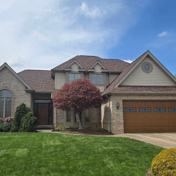 completed residential roof replacement shingles home