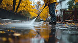 ai-generated-man-power-washing-his-road-in-wet-weather-with-rain-free-photo.jpeg