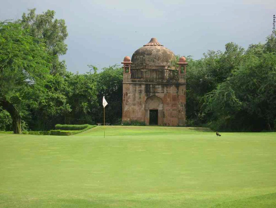 golf course with an Indian building in the background